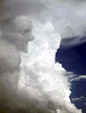 face in clouds